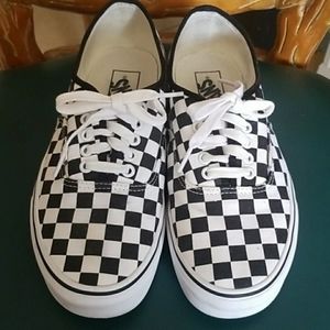 Black and White checkered Vans.
